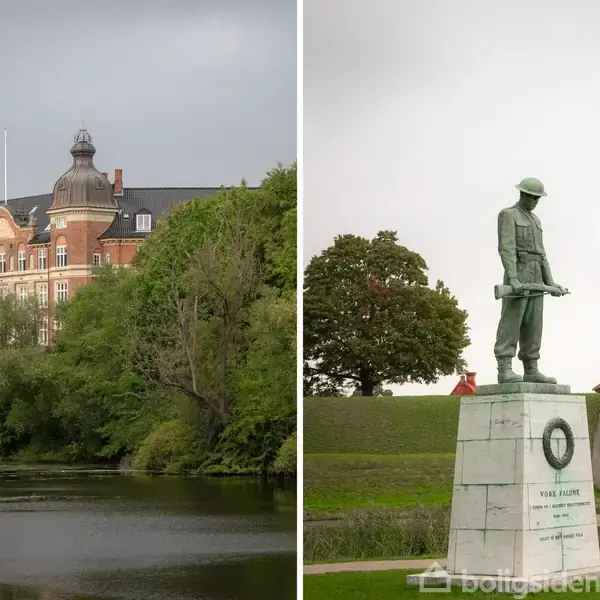 En rød murstensbygning med kupler står ved en vandkanal omgivet af træer. Ved siden af ses en soldatstatue på en sokkel i en græsbevokset park.
