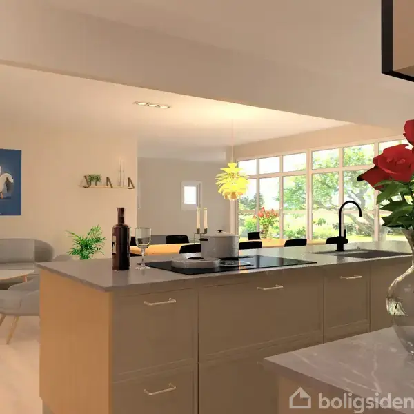 Køkken-ø med røde roser i gennemsigtig vase står centralt på en lys bordplade. Stue møbleret med sofa og dekoreret med vægkunst i baggrunden. Design by Toni Agerup SA Ark Design.