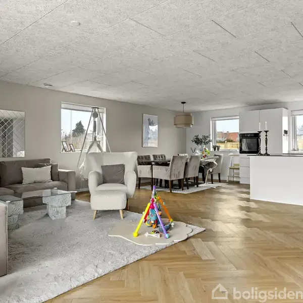 En etplans villa med lyse mursten, fladt tag og skorsten, står ved siden af en garage. Husnummer 90 er synligt. Omgivet af flisebelagt indkørsel og en grøn hæk.