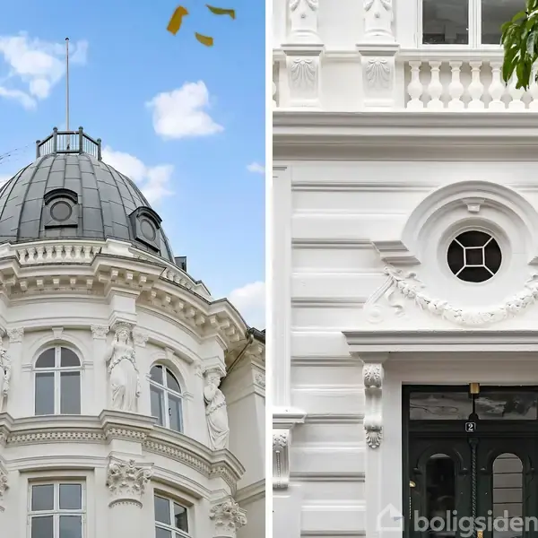 Kuplen på en hvid, traditionel bygning med udsmykkede detaljer står under en blå himmel. Ved siden af ses en elegant hoveddør omgivet af arkitektoniske udsmykninger og et rundt vindue.