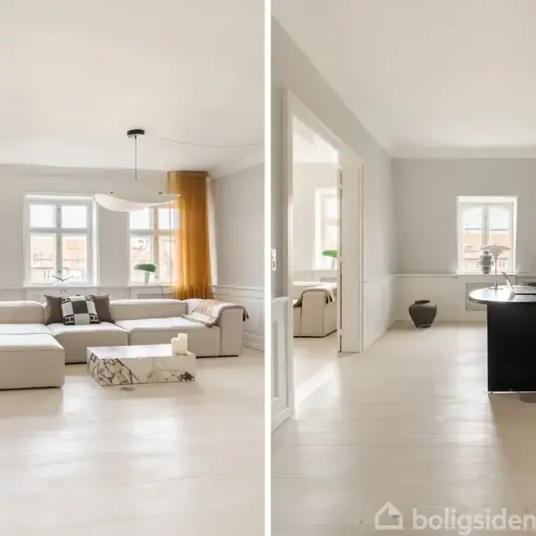 Stor stue med lysegrå vægge og store vinduer; indeholder en stor sofa og bord til venstre. Ved siden af, rummeligt kontor med sort skrivebord og stol, dekoreret med vægkunst.