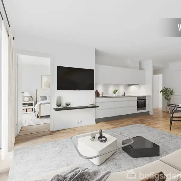 Stue med moderne sofa og sofabord i forgrunden, tv monteret på væg. Åbent køkken i baggrunden integreret med spisestue. Lyse nuancer dominerer rummet. Tekst: "VISUALISERING".